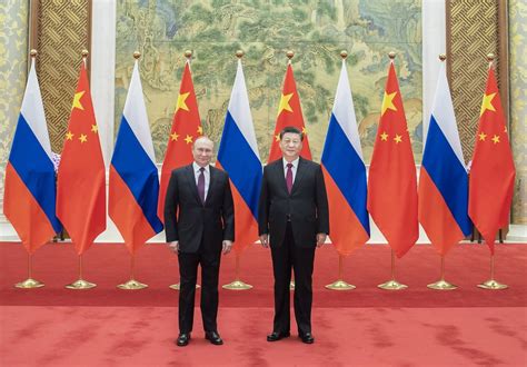 Russian President Putin and Chinese leader Xi meet in Beijing and call for close policy coordination